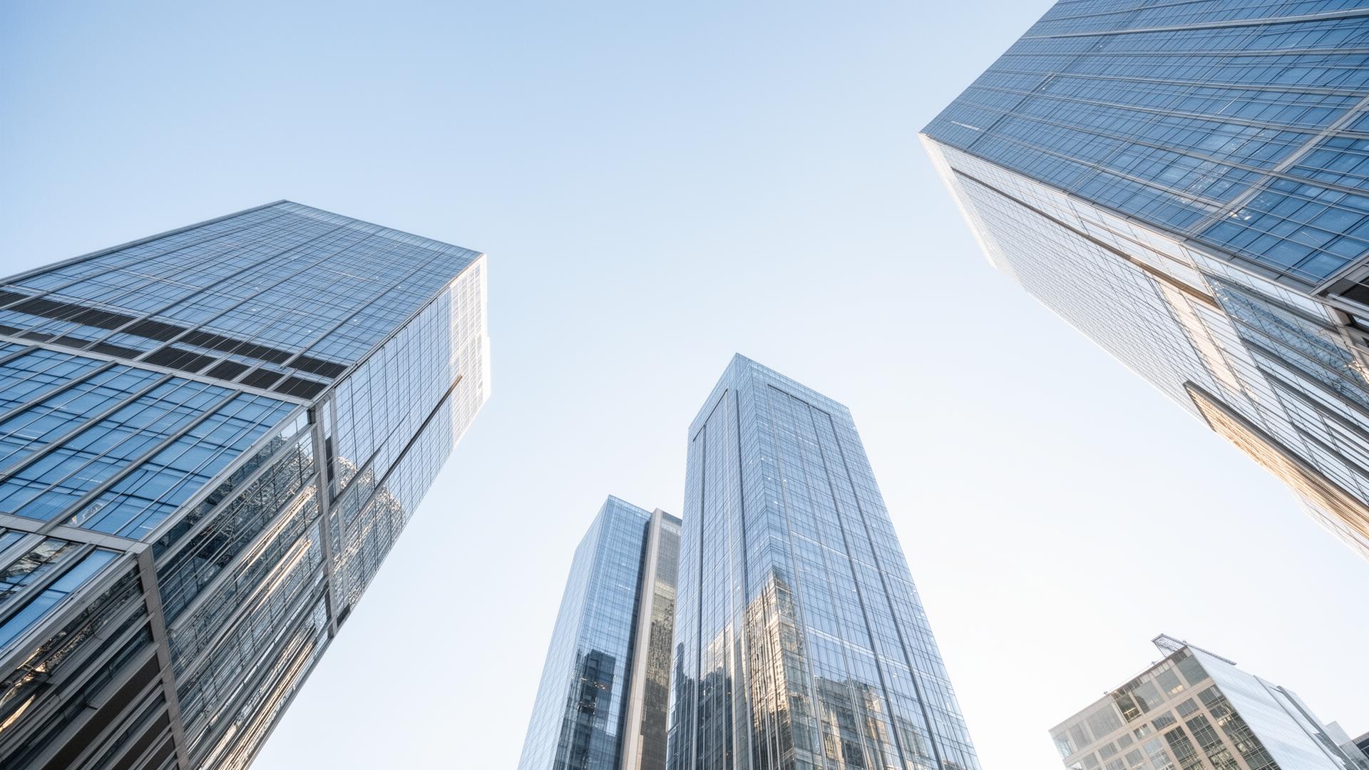 Modern high-rise skyscrapers reaching into a clear blue sky